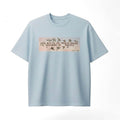 light blue t-shirt with a graphic design on a white background
