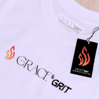 White t-shirt with a printed logo and tag of Grace & Grit 
