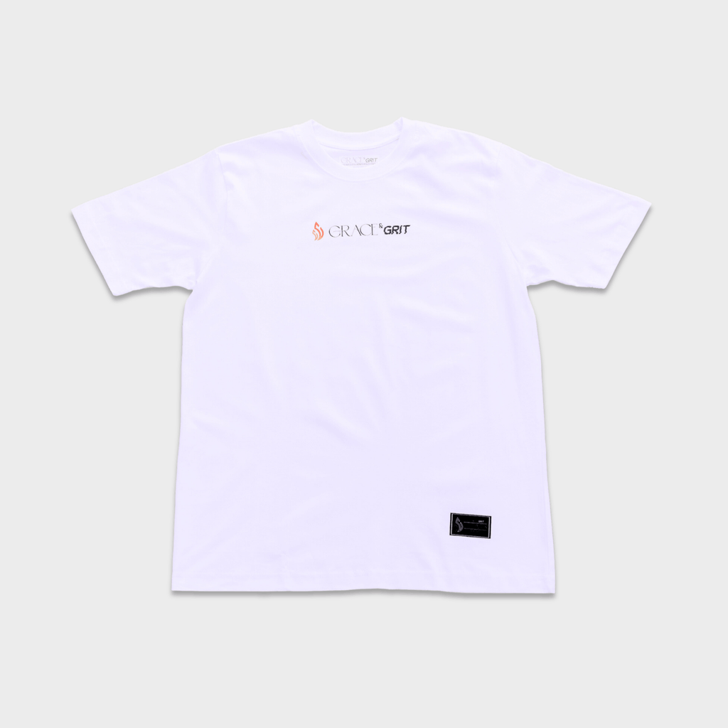 White t-shirt with a logo of Grace & Grit on a plain background