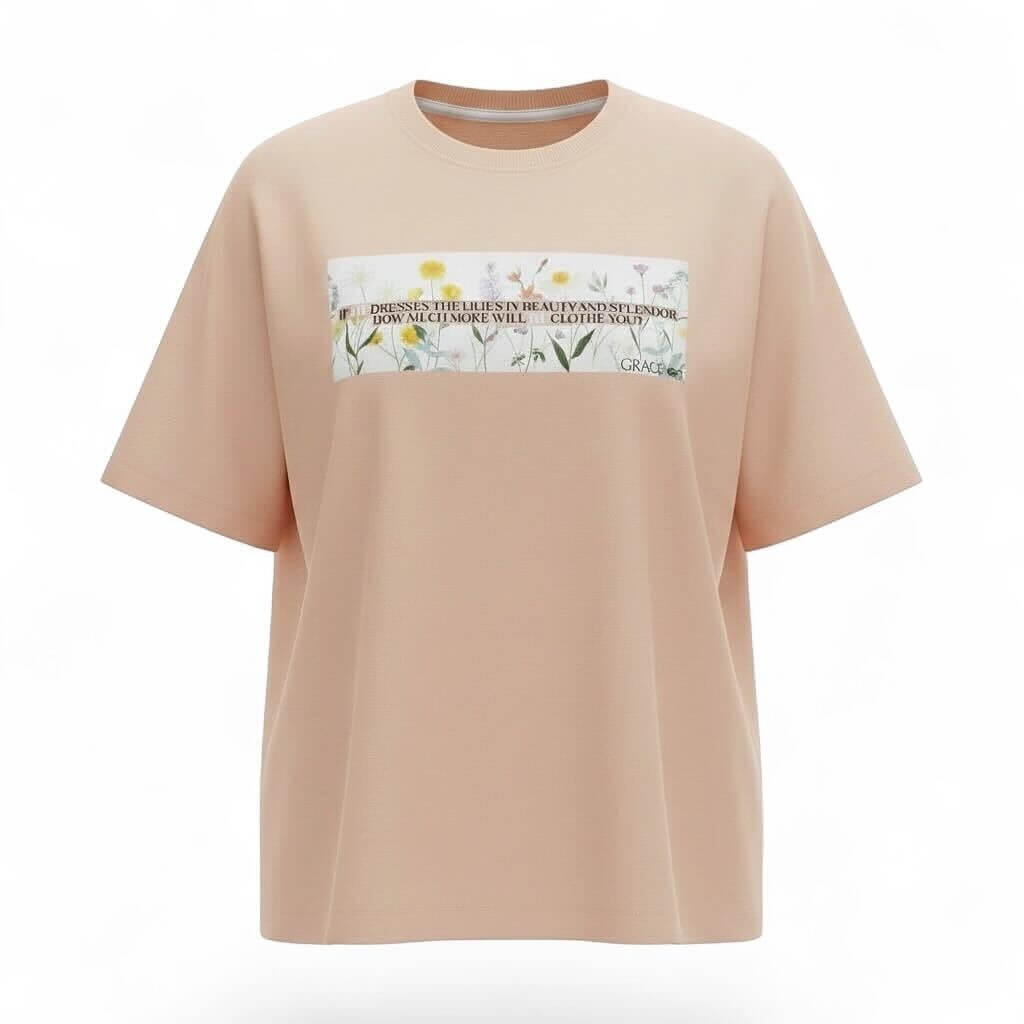 Peach t-shirt with a graphic design on a white background