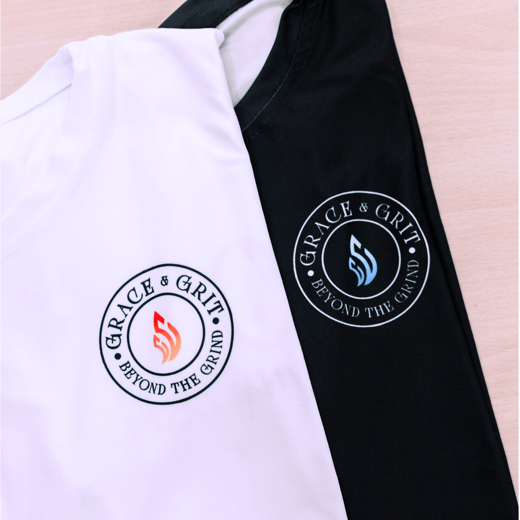 White and black shirt with 'Grace & Grit' logo on a plain background