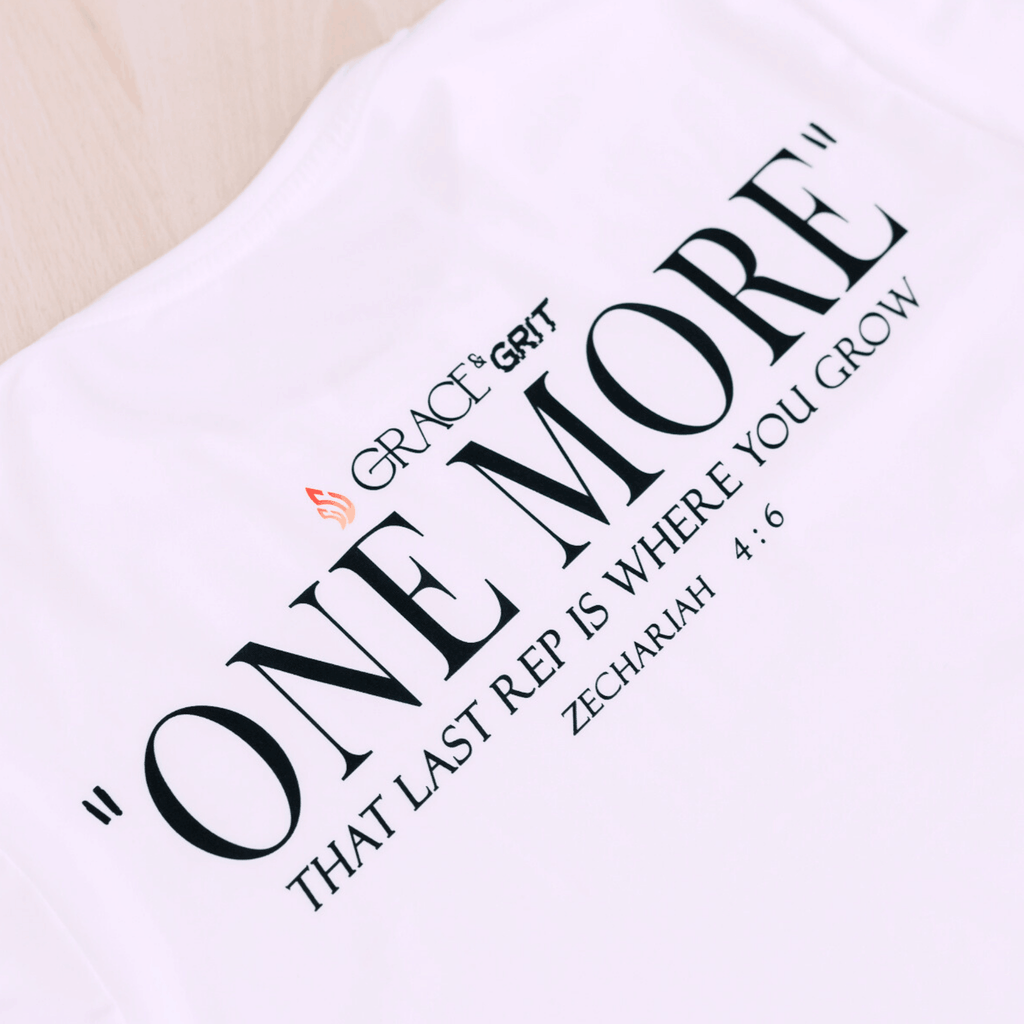 White t-shirt with motivational quote 'One More That Last Rep Is Where You Grow' by Grace & Grit 