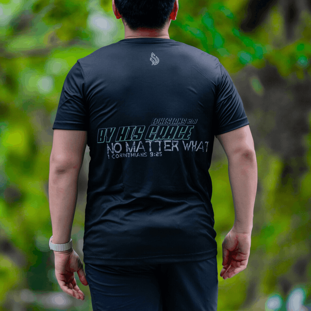 A gentleman facing away wearing a mint and black running shirt with text that says 'Ephesians 2:8. By His grace No Matter What. 1 Corintians 9:25' on his back.