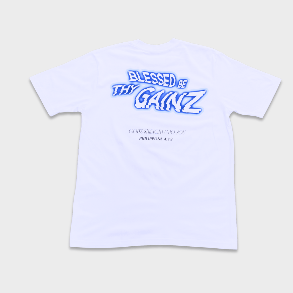A white shirt with a print that says 'BLESSED BE THY GAINZ' and "'GOD'S STRENGTH UNTO YOU' PHILIPPIANS 4:13".